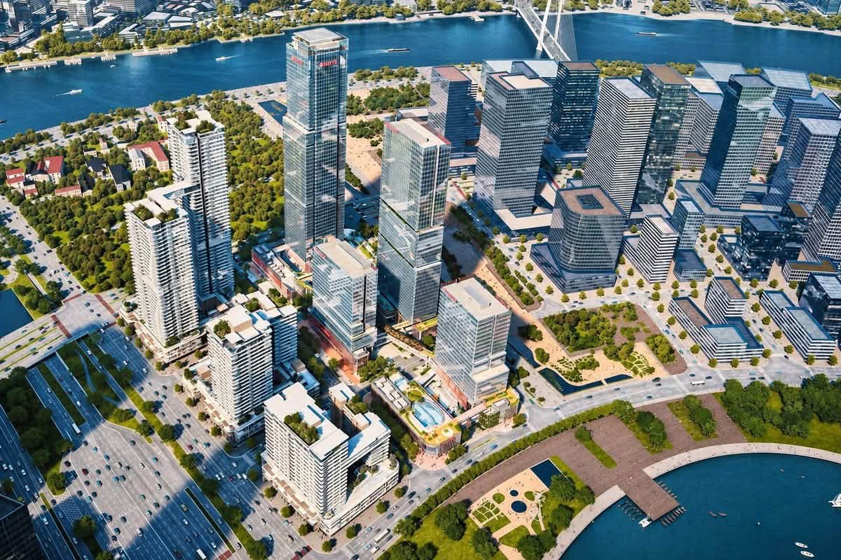 Phối cảnh tổng thể Lotte Eco Smart City bên hồ trung tâm Thủ Thiêm Phối cảnh từ trên cao Lotte Eco Smart City Thủ Thiêm với cụm tháp văn phòng, căn hộ, hồ trung tâm và sông Sài Gòn